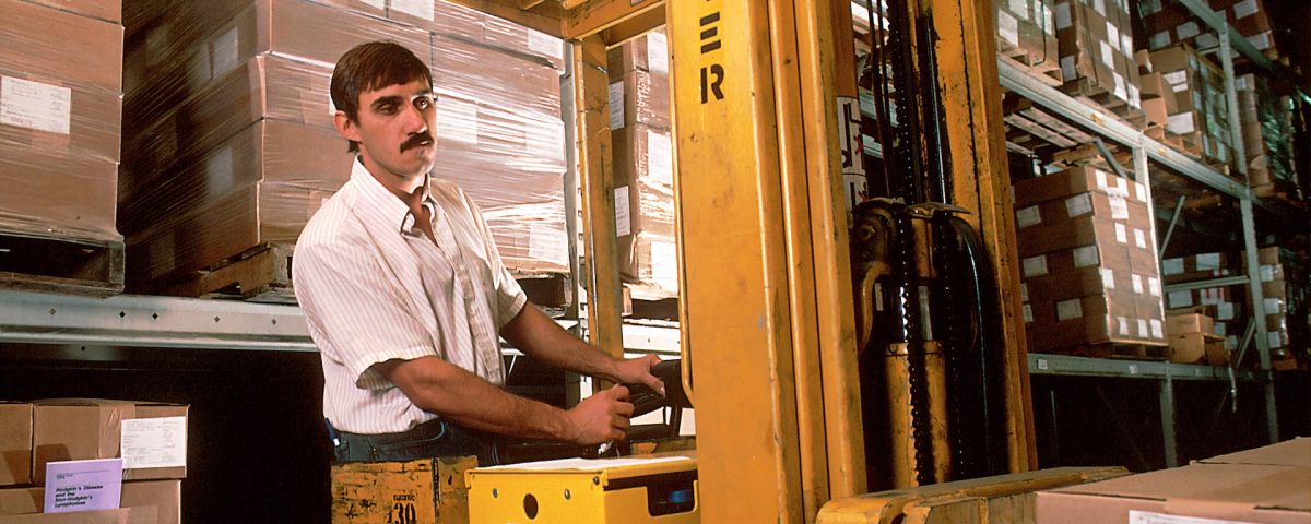 man driving a forklift